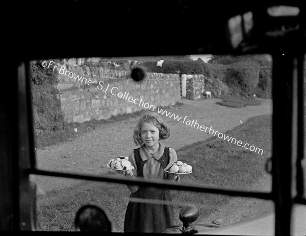 THROUGH WINDSCREEN GIRL SELLING BUNS